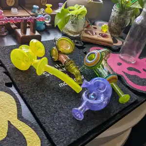 An array of handblown glass pipes and dry pieces