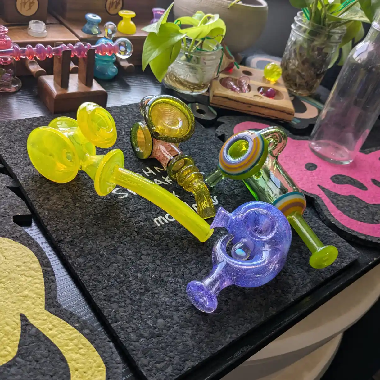 An array of handblown glass pipes and dry pieces