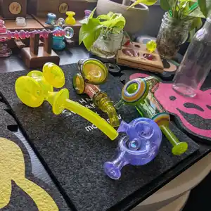 An array of handblown glass pipes and dry pieces